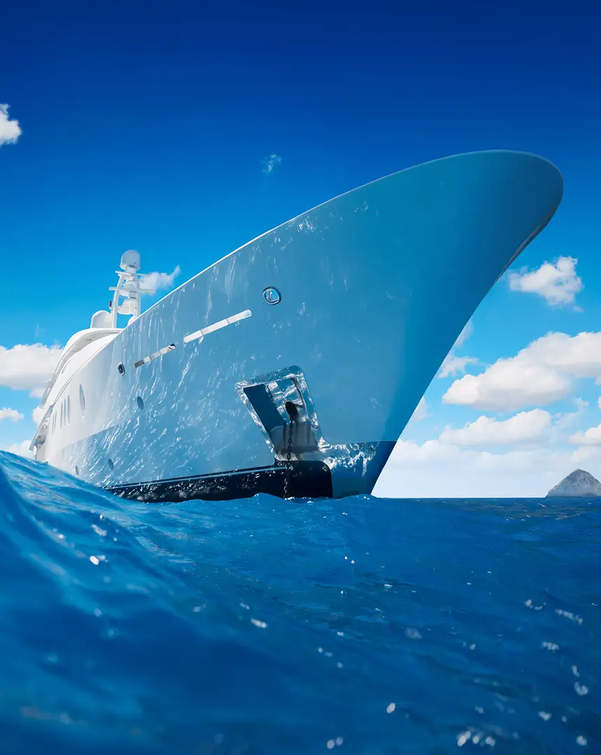 Low-angle view of a modern superyacht cutting through clear blue water on a bright day, highlighting its sleek bow and contemporary design, reflecting Teji | Cowie’s superyacht focus.