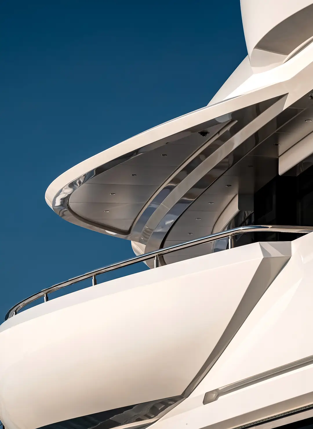 Close-up view of a modern superyacht’s upper deck and architectural overhang, highlighting sleek lines and premium build quality often reviewed during yacht purchase agreements and new-build legal inspections.